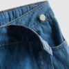 Asymetrická zavinovací sukně z bavlněného denimu