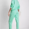 Úzké tepláky s manžetami